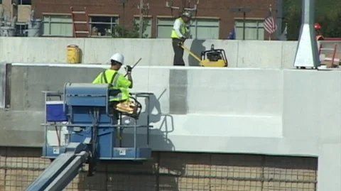 Bridge Construction worker rolls paint Stock Footage 105553231