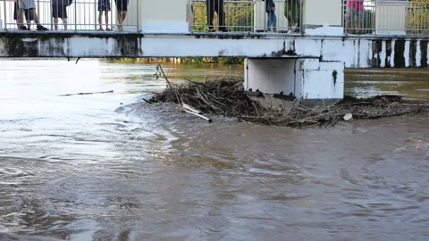 A bridge is covered in water and debris Stock Footage 296370167
