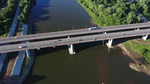 Bridge crossing the river.Trucks. 스톡 동영상 111976775
