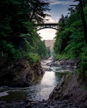 The bridge in the gorge over the river Stock Photos