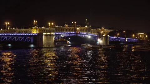 Bridge with illumination over the river at night Stock Footage