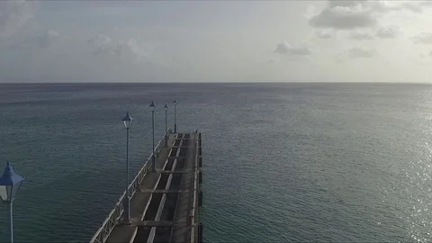Bridge jetty leading out to ocean Stock-Footage 88573201