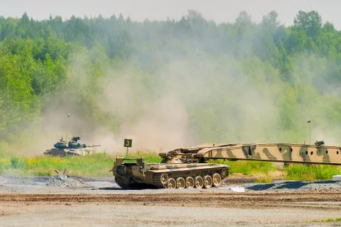 Bridge layer MTU-72 in action under tank cover Stock Photos