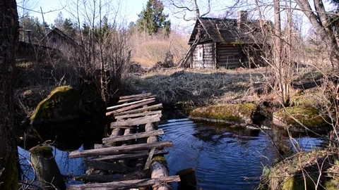 The bridge leading the path to the forest hut Stock Footage 76036138