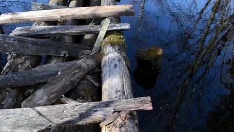 The bridge leading the path to the forest hut 2 Stock Footage 76036141