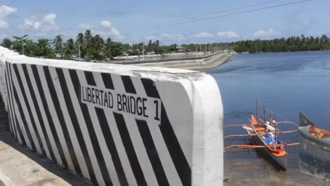 Bridge in Lebertad Valley with a Cool Fund Fish in the River Beach on a Village Stock Footage 332364641