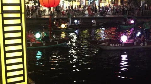 Bridge lighting with tourists on gondolas in the background Stock Footage 345787278