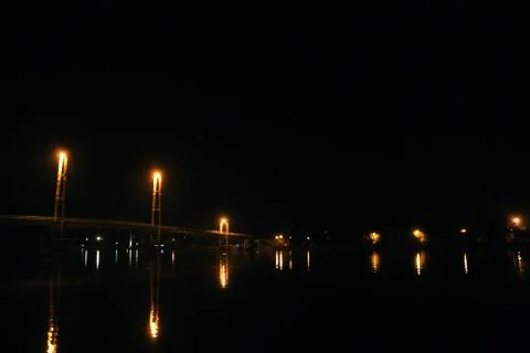 Bridge lights reflections on river Stock Photos