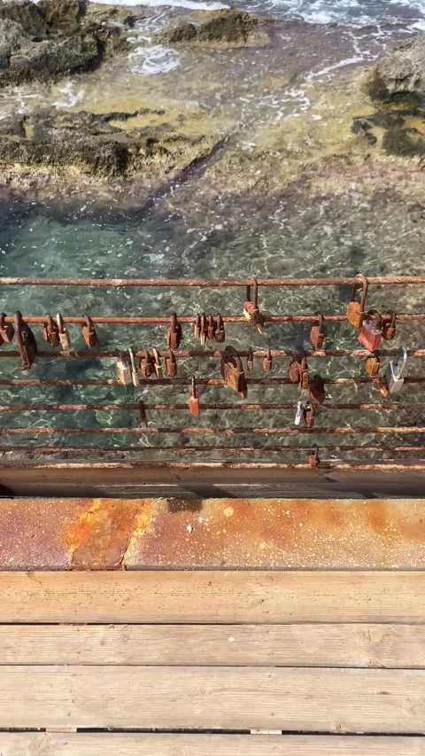 Bridge. Locks on the bridge. Making a wish. Vertical video Stock Footage 286229504