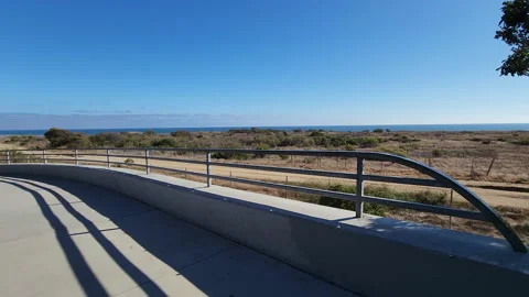Bridge metal rail with a nice beach view horizon in a sunny day Stock-Footage 201285024