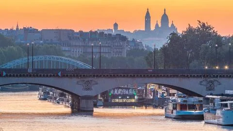 Bridge near Eiffel tower and the Seine river night to day transition timelaps Stock Photos