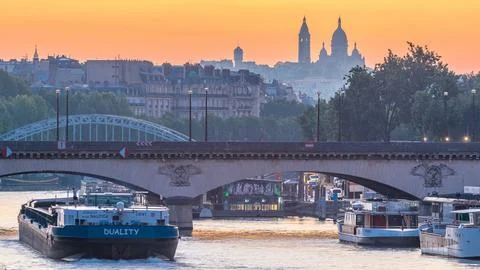 Bridge near Eiffel tower and the Seine river night to day transition timela.. Stock Photos