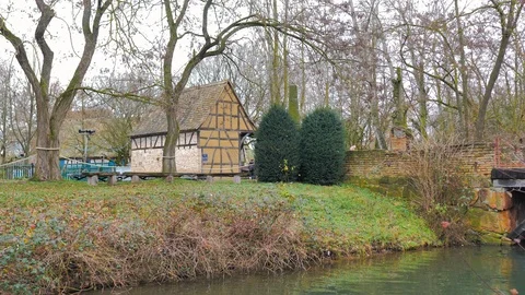 Bridge next to old abandoned half-timbered house in autumnal landscape Stock Footage 124472242