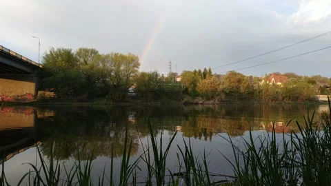 Bridge of old Zhytomyr town, during sunny rain with a rainbow Stock Footage 157101751