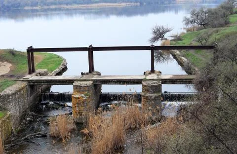 Bridge over artificial waterfall Foto stock