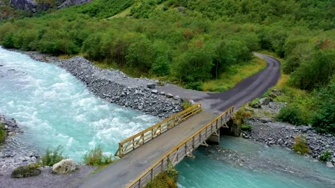 Bridge over a beautiful gushing river in a forest Stock Footage 167403482