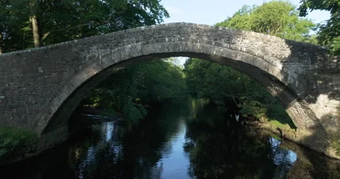 Bridge over a calm river Stock Footage 283991707