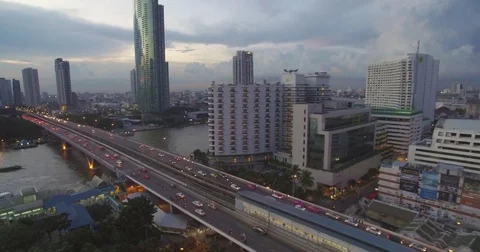Bridge Over Chao Phraya River in Bangkok at Dusk, Ascending Pullback Drone Shot Stock Footage 71316029