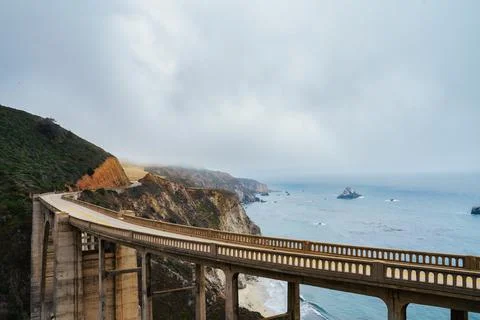 Bridge over cliffs and ocean Stock Photos