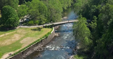 Bridge over creek from high angle, Croton Groge, New York - 4K Nature Stock Footage 242793042