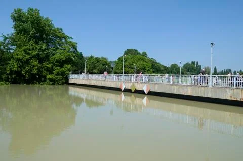 Bridge over flooding river Stock Photos