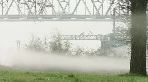Bridge over grass, fog rolling by, Timelapse Stock Footage 53348500