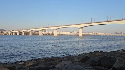 Bridge Over Han River in Seoul with Camera Tilt Up to Blue Sky Vídeos de archivo 330756716