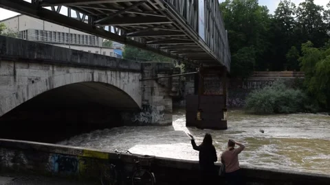 Bridge over the Isar river in munich with flooded water Stock Footage 133019864