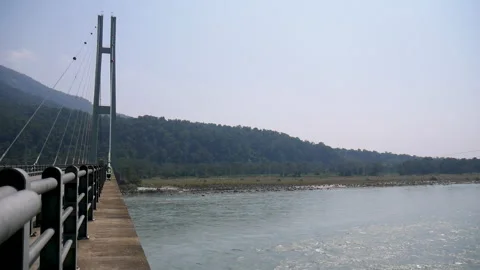 Bridge over Karnali river, water flowing calmy Stock Footage 246723710