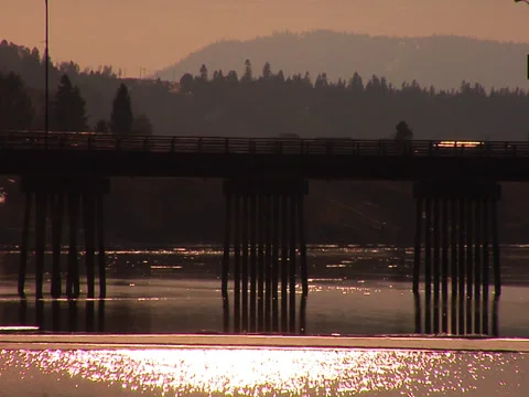 Bridge over lake at sunset 스톡 동영상 34858835