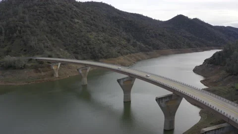 Bridge over mountain lake Stock Footage 230776957