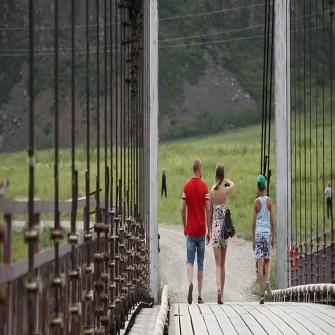 Bridge over mountain river. People. Nature. Russian mountain Siberia. Altai. 스톡 동영상 69442764