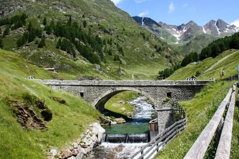 Bridge over mountain river Stock Photos