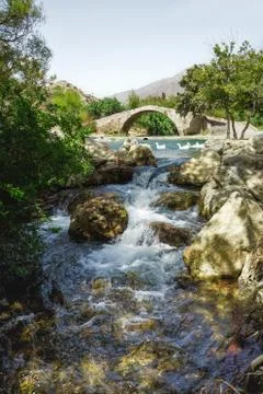 Bridge over mountain river Stock Photos