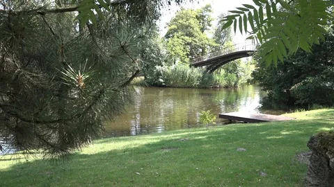 Bridge over the pond in the park Video stock 100288737