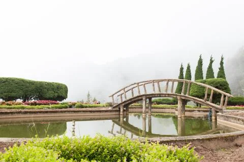 Bridge over pond Stock Photos
