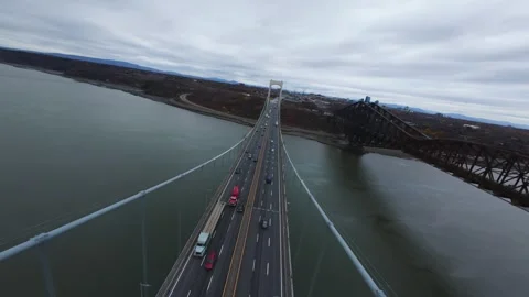Bridge over quiet river — minimal cloudy view Stock Footage 320588207