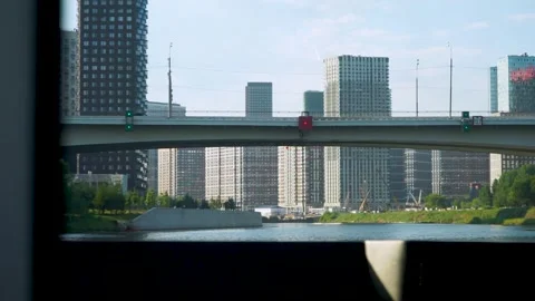 Bridge over the river against the backdrop of skyscrapers Stock Footage 264781740