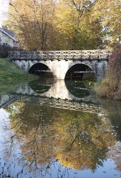 Bridge over the river in autumn Stock Photos