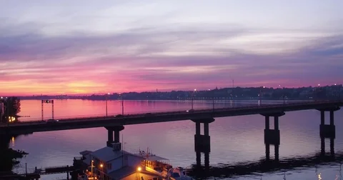 Bridge over the river in beautiful pink sunset, aerial shot Video stock 76983531