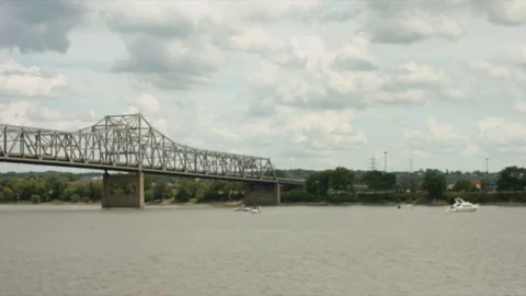 Bridge Over River with Boats Stock Footage 77558030