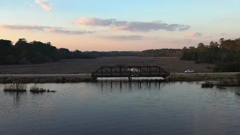 Bridge Over the river, car passing through small town. Stock Footage 153800778