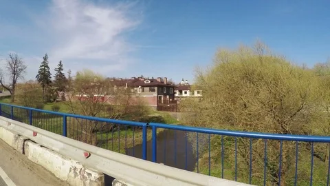 Bridge over the river cottage settlement Vídeos de archivo 75157254