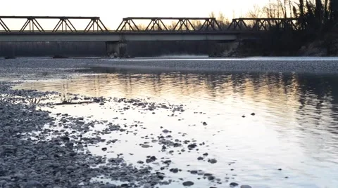 Bridge over the river at dawn in winter Stock Footage 63456076