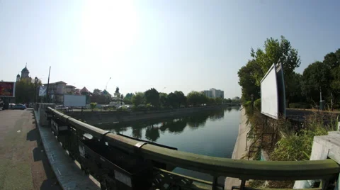 Bridge Over River In Downtown Bucharest, Traffic, Sunny Day, Pan, Fish Eye Lens Stock Footage 55790334