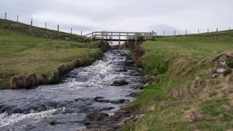 Bridge over river Dunseverick Waterfall Northern Ireland Vídeos de archivo 303451022