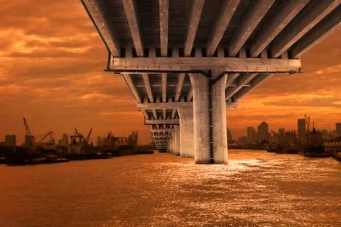 Bridge over river with dusky sky scene 写真素材