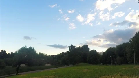 Bridge over a river in evening summer park timelapse 스톡 동영상 78017630