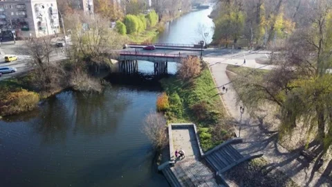 Bridge over the river, flock of pigeons, autumn, drone photography Video stock 164172925