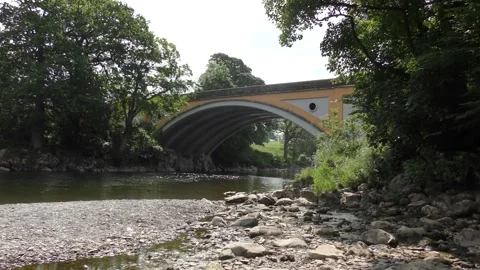 Bridge over River Lune Kirkby Lonsdale stones in the foreground Stock Footage 250653568